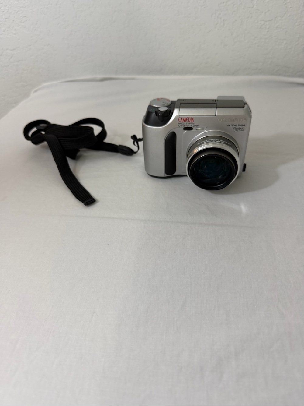 Olympus Silver Compact Digital Camera with Black Wrist Strap